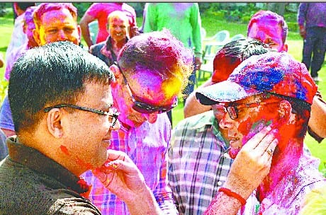 Police officials celebrate Holi