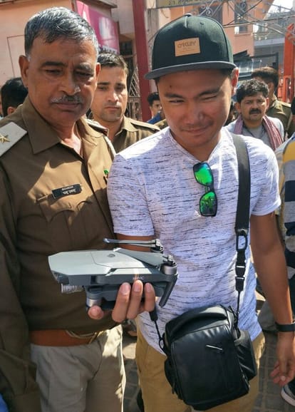 tourist fly a drone camera near taj mahal