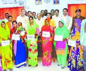 Family destroyed by illicit liquor get cheque