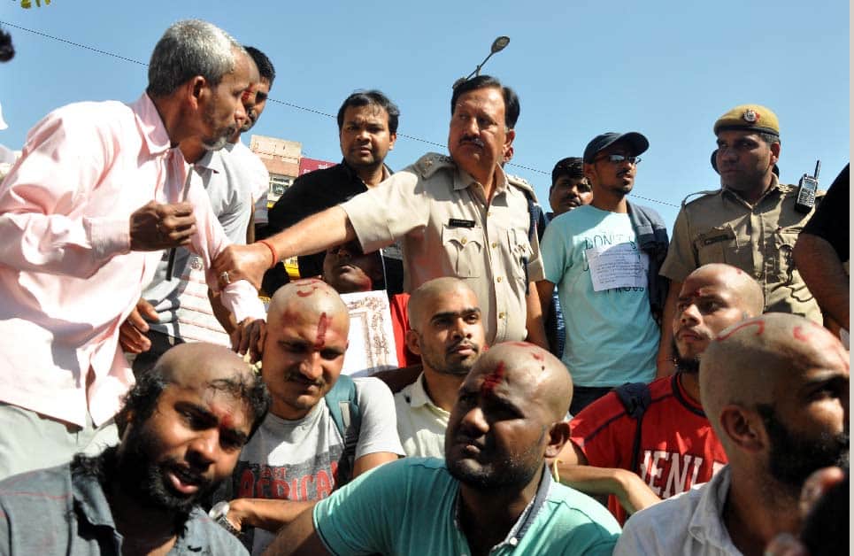 SSC paper leak case, protest by shaving off the hair -  barber taken to custody