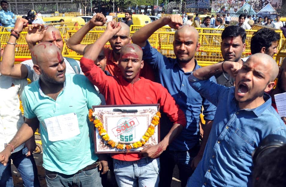 SSC paper leak case, protest by shaving off the hair -  barber taken to custody