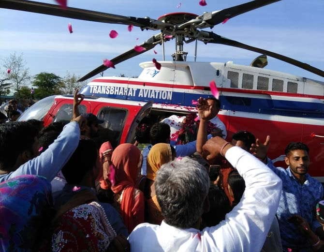 unique marriage, rohtak bride farewll via helicopter