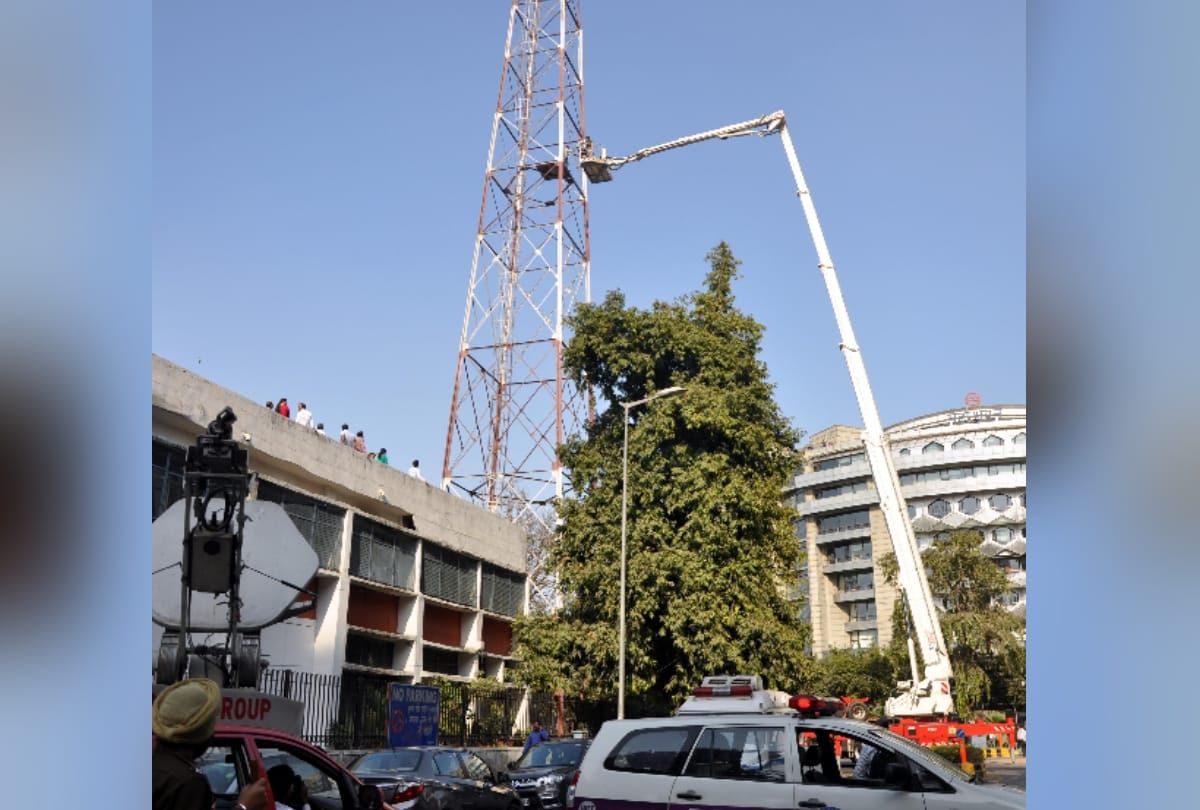 when upset man from domestic issues climbs over a tower and it took three hours to rescue him