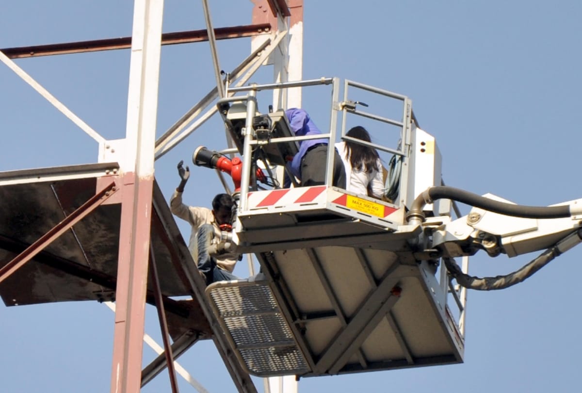 when upset man from domestic issues climbs over a tower and it took three hours to rescue him