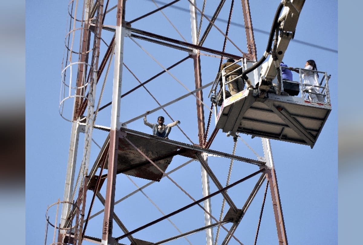 when upset man from domestic issues climbs over a tower and it took three hours to rescue him