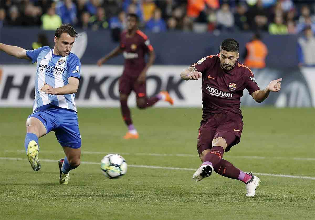 la liga barcelona beat malaga by 2-0 without lionel messi