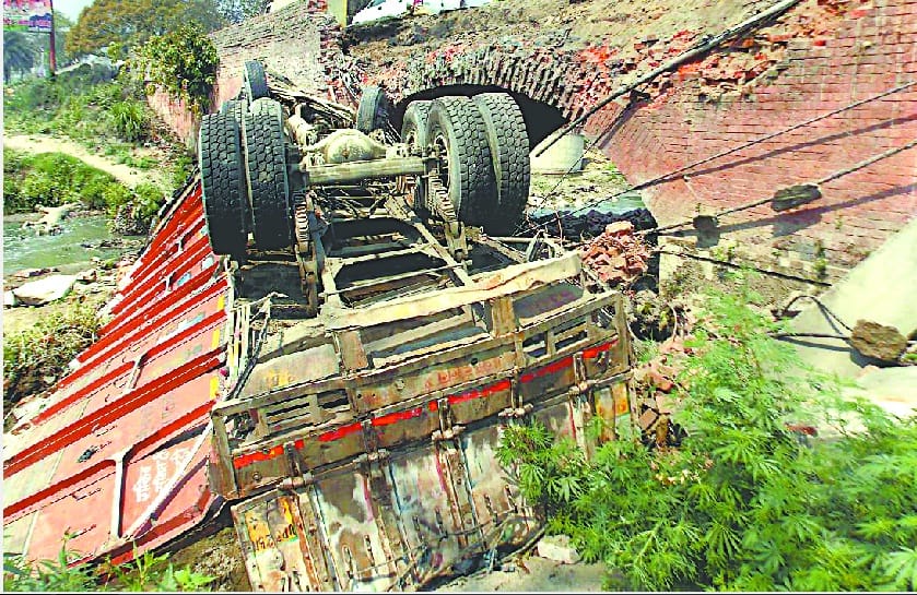 A truck full of sand fallen in river