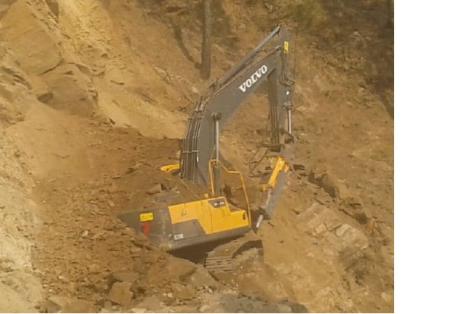 JCB drowned in the rubble near Dhon