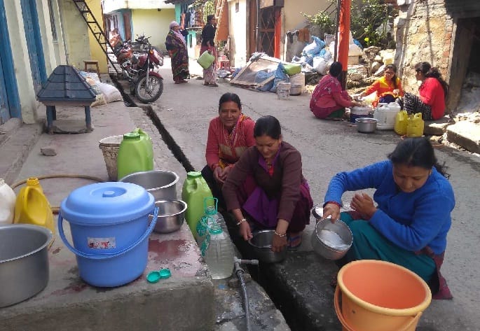 Women forced to fill water with leakage made in line