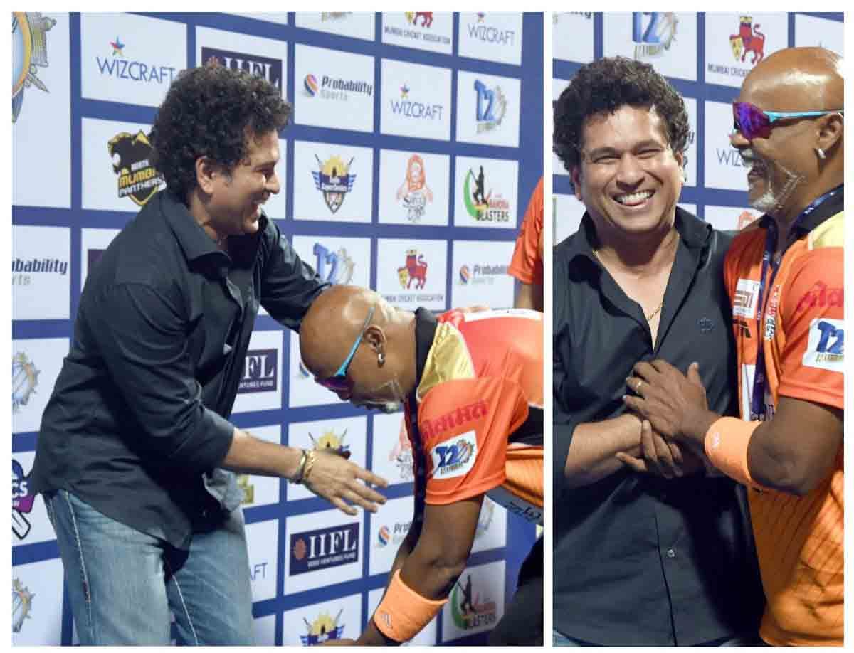 vinod kambli tries touching feet of sachin tendulkar and then they hugged each other