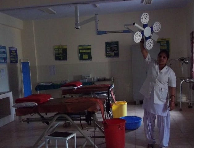Nurse delivering childbirth in district hospital
