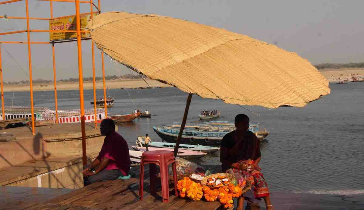 Traditional umbrella disappearing from ganga ghat of varanasi