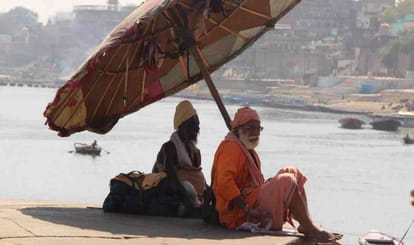 Traditional umbrella disappearing from ganga ghat of varanasi