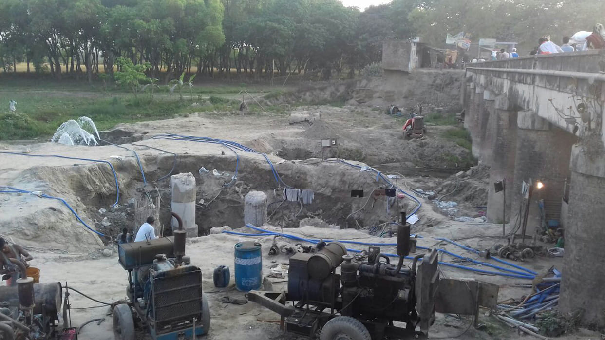 Delay in bridge construction due to illegal occupation.