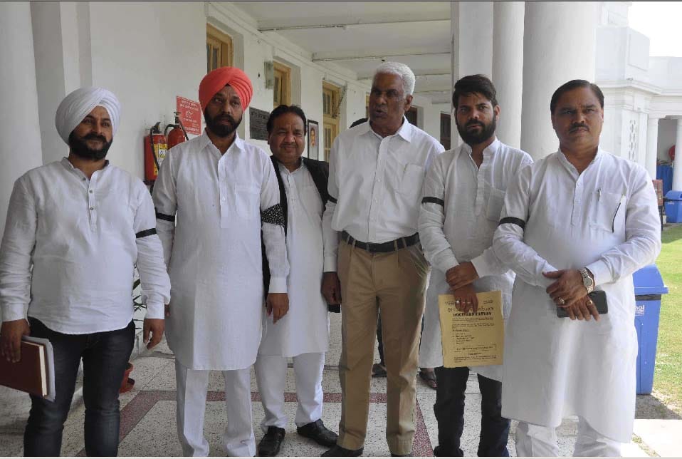 Delhi Assembly Speaker run the House  with  the black band at a protest against officers