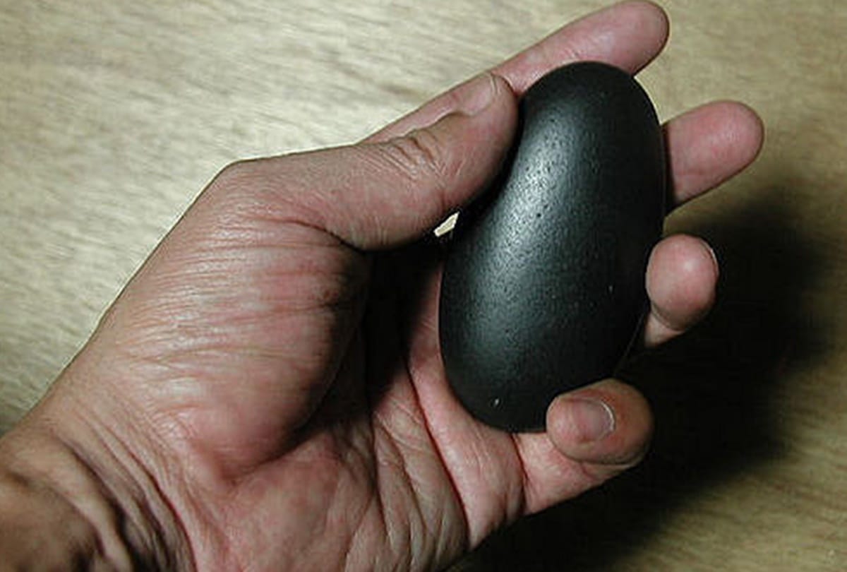 school teacher was trying to make his child fair by rubbing him through black stone