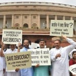  BJP MPs protest against congress in parliament premises for washed out of session