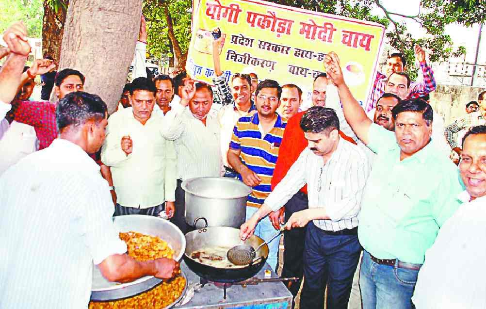 Electric workers pick up tea sold in protest against privatization