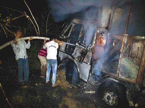 Bike driver dies due to trapping in two trucks