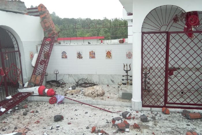 Temple dome damaged by falling power