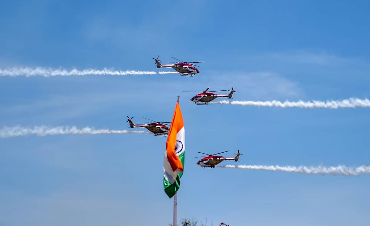 Indian Air Force's 'Sarang' display team performs on the 3rd day of the DefExpo 2018