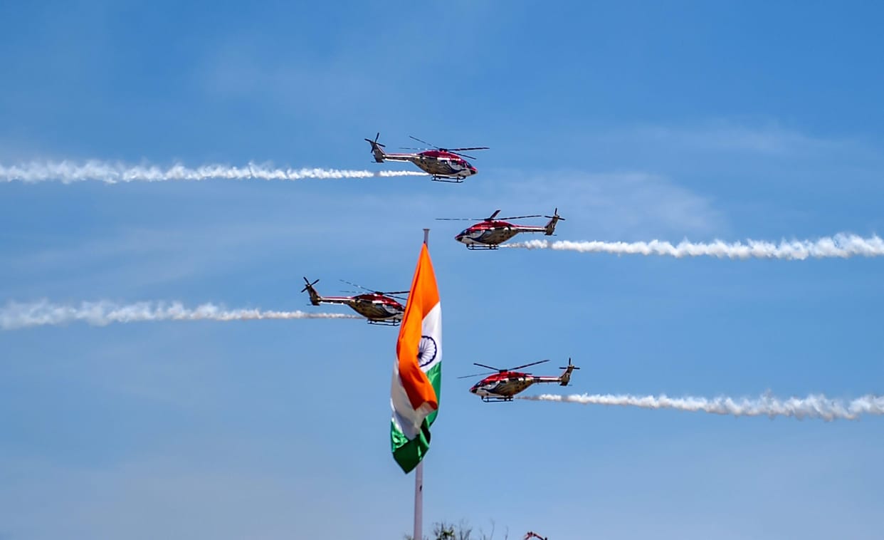Indian Air Force's 'Sarang' display team performs on the 3rd day of the DefExpo 2018