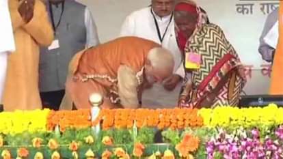 Watch PM Modi presents a pair of slippers to a tribal woman on Ambedkar Jayanti