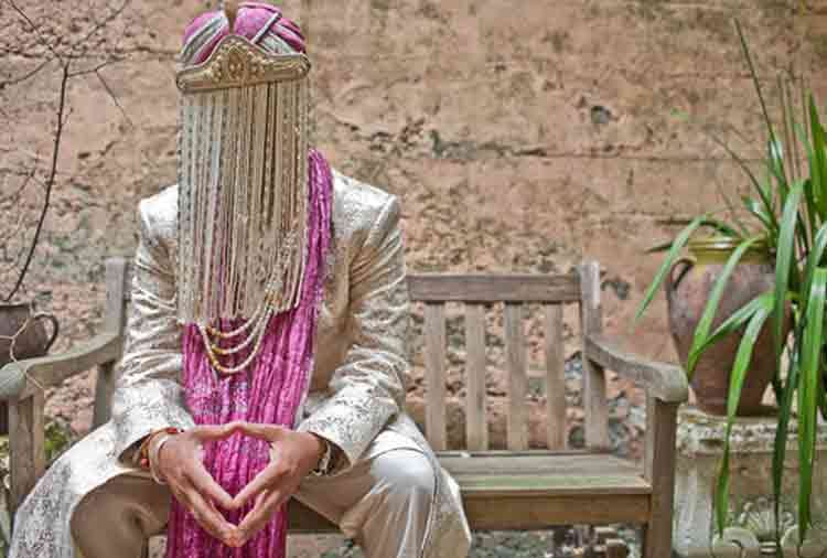 pakistani groom wear golden shoes and golden tie on his marriage reception