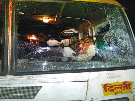 Youth returning from Army recruitment stone throwing on bus