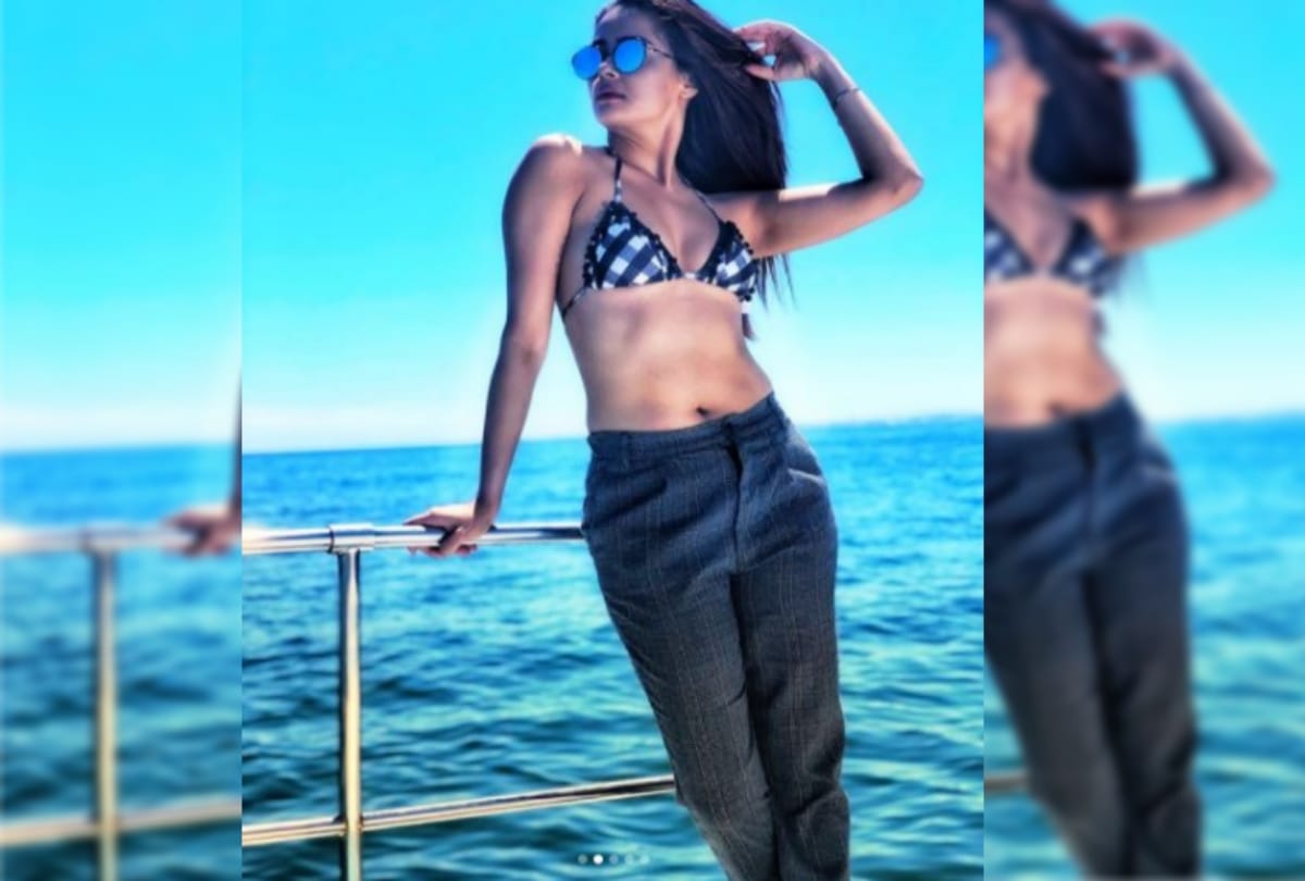 hotness alert actress Surveen Chawla poses in bikini and a trouser