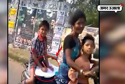 VIRAL VIDEO KIRAN RIJUJU POSTED STUDENT DOING HOMEWORK ON SCOOTY WILL MOTHER IS DRIVING