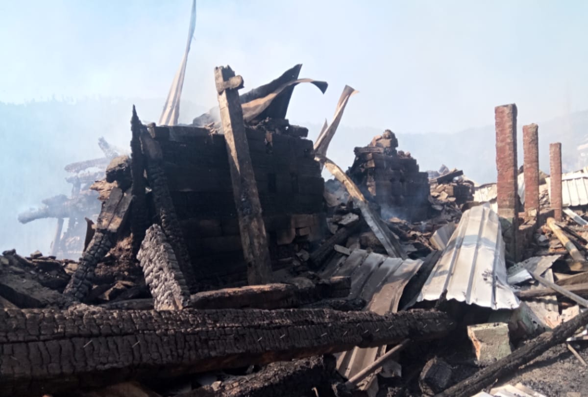  sparks moving up from the debris creating danger for the remaining homes
