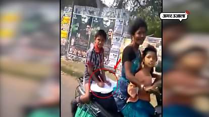 VIRAL VIDEO KIRAN RIJUJU POSTED STUDENT DOING HOMEWORK ON SCOOTY WILL MOTHER IS DRIVING