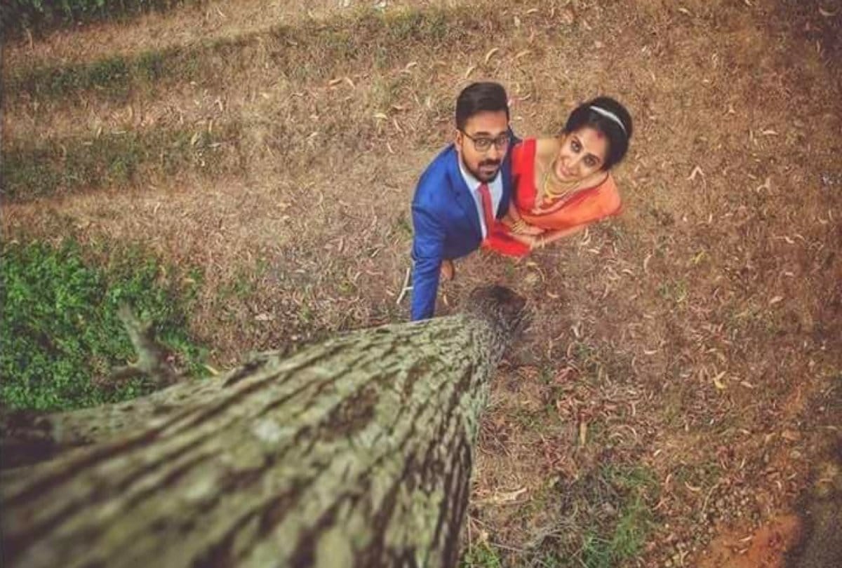 video being viral of this photographer hangs on a tree to get perfect click