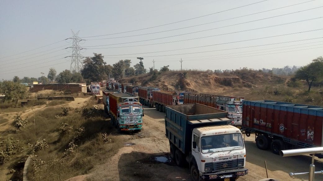 Long jammed with overloaded trucks