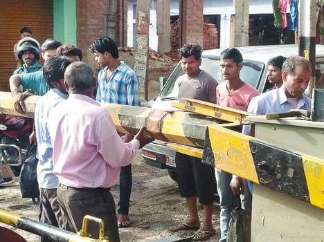 Boom broken by truck collision, driver detained