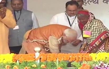 prime minister narendra modi bent down and slipped her feet into a pair of sandals