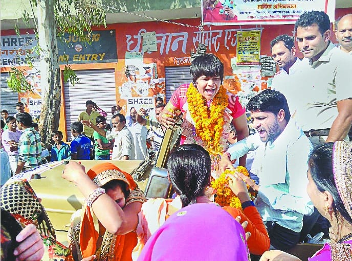 Wrestler returned after winning bronze medal