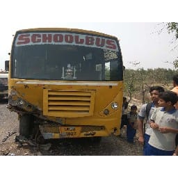 a car collisen school bus on the highway