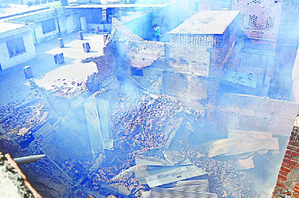  Three-story building collapsed with a fire