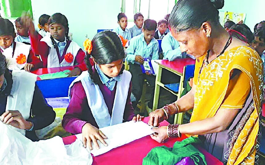 girls learning stich work at school