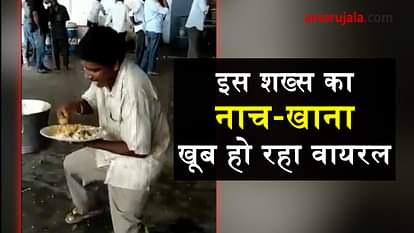 man dancing while eating food
