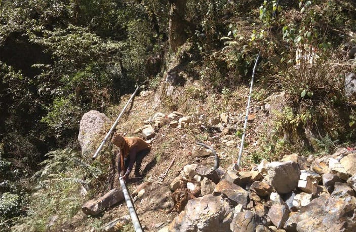 Broken drinking water line from wreckage of perennial road