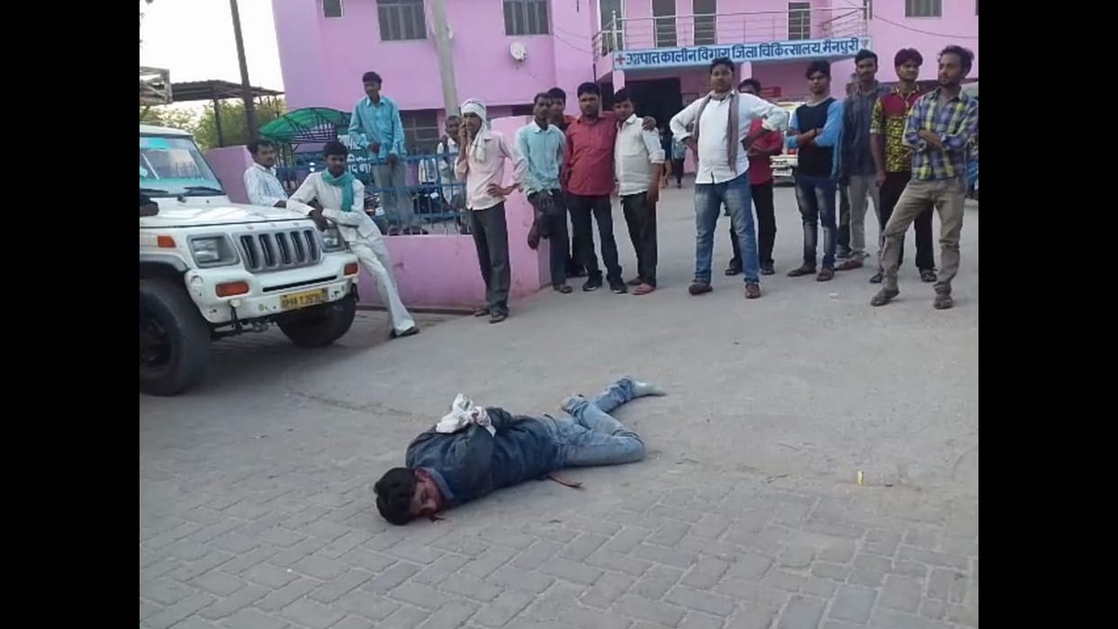 drunken young man's hands tied by police