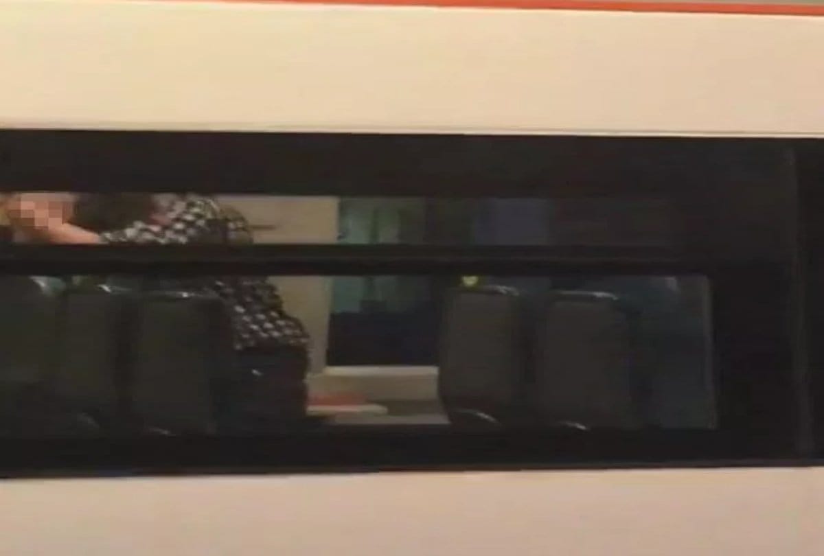 Couple intimate in a train at Britain 
