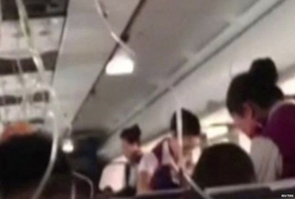Plane Windshield broken suddenly and pilot hangs out half at china