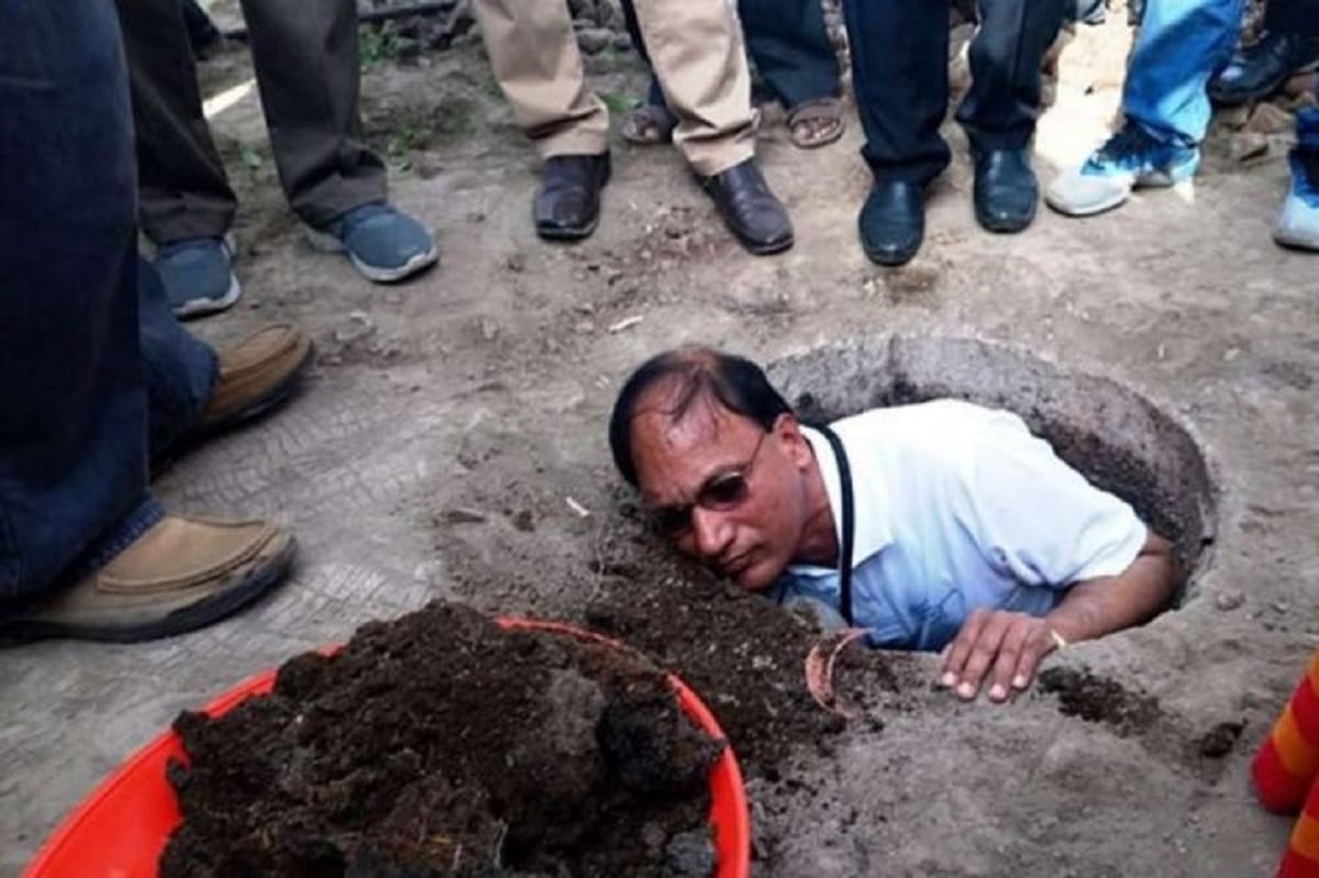 district Collector of Telangana jumps into gutter for cleaning