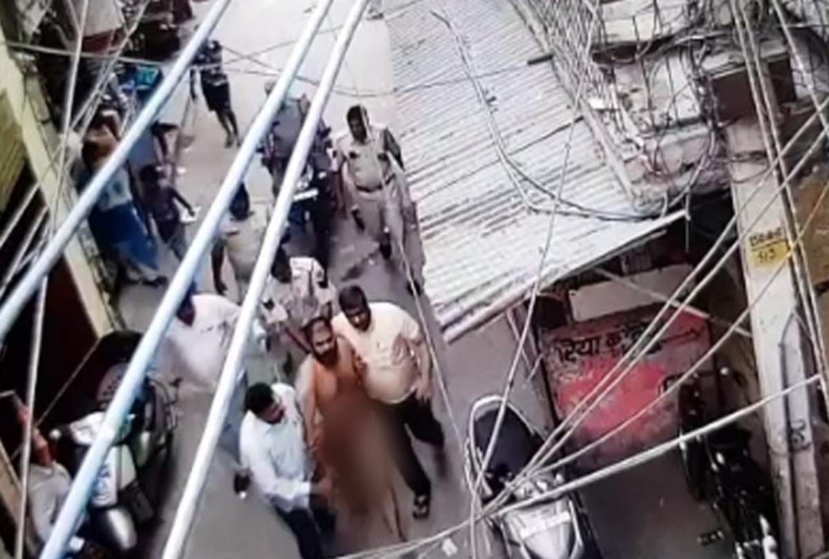 Delhi police parading man naked in market at inderpuri