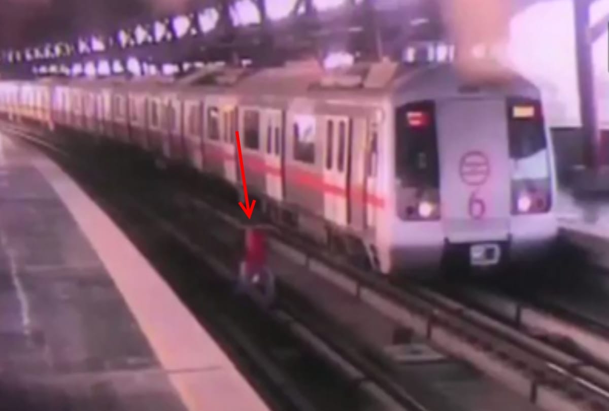 a man narrow escape when delhi metro driver stops metro while he was crossing flatform via track