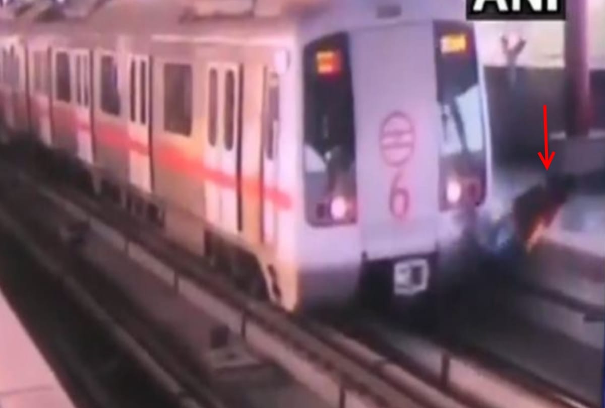 a man narrow escape when delhi metro driver stops metro while he was crossing flatform via track